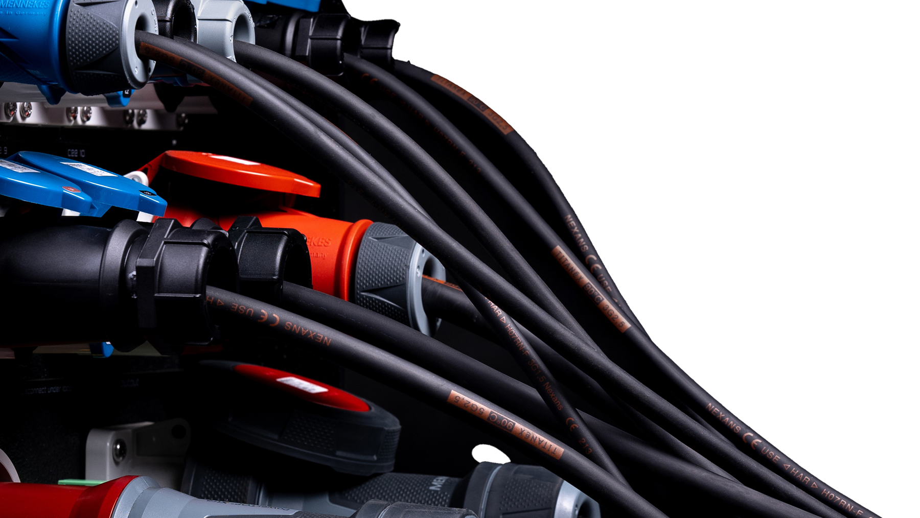 Black power cable bundle connected to coloured PDU sockets.